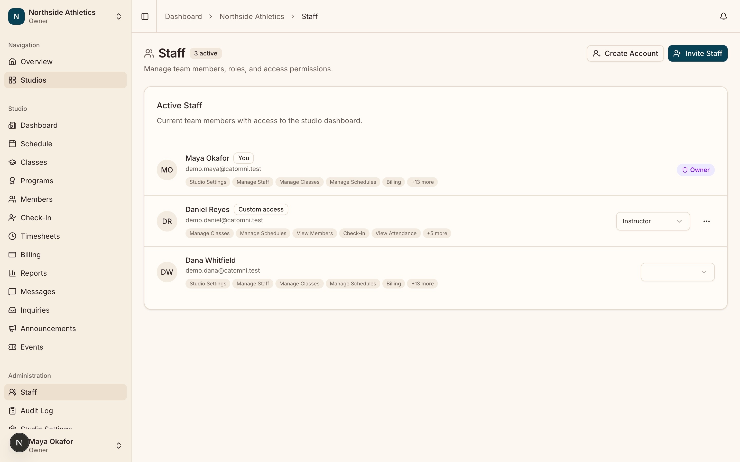 The staff directory listing every active member with their role, the permissions each one carries, and the per-row role picker.